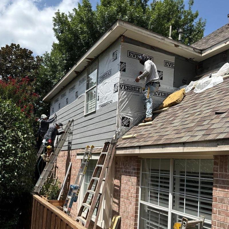 workers installing siding